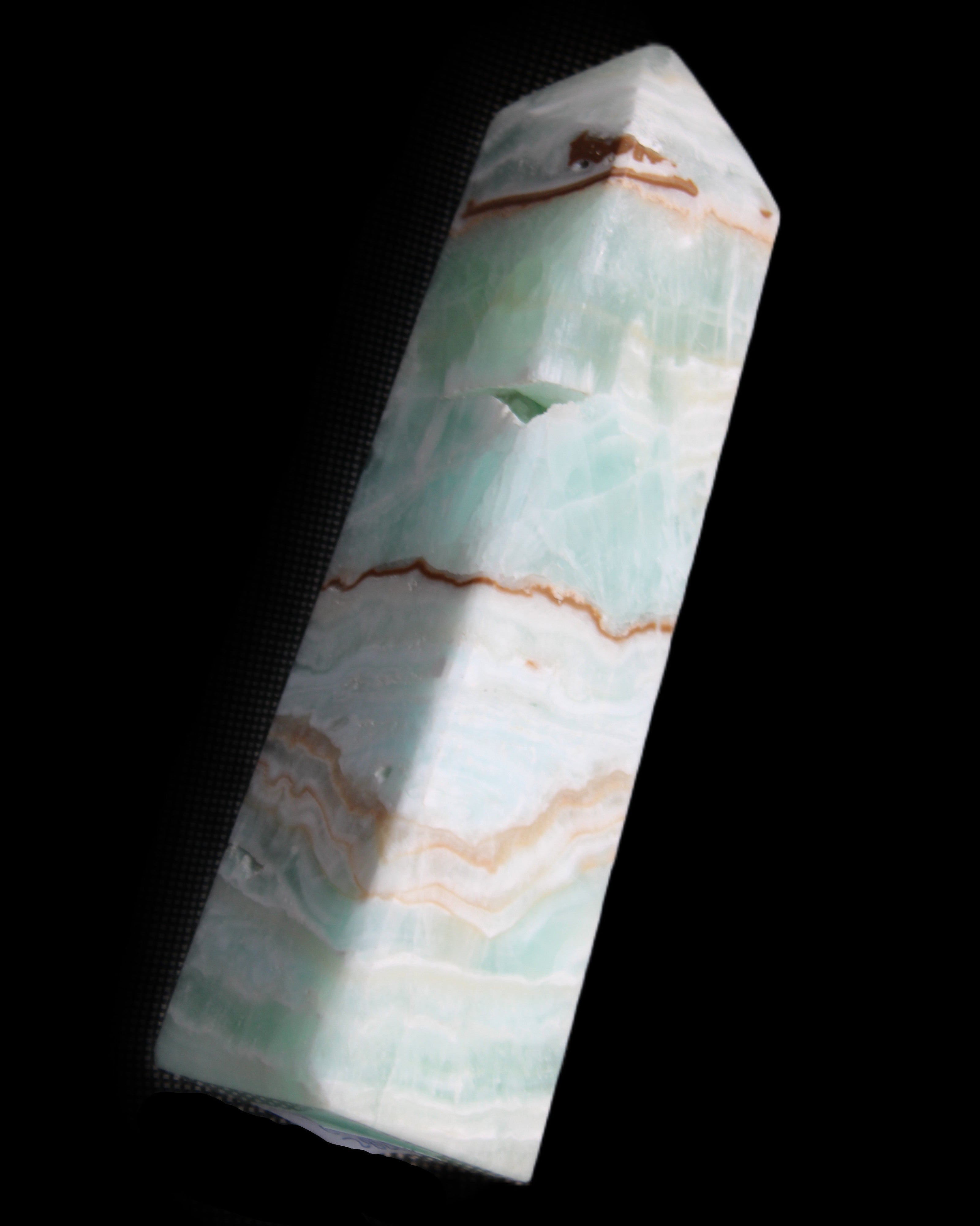 Pistachio Calcite obelisk 134mm 339g in sunlight - Rocks and Things Store