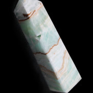 Pistachio Calcite obelisk 134mm 339g in sunlight - Rocks and Things Store