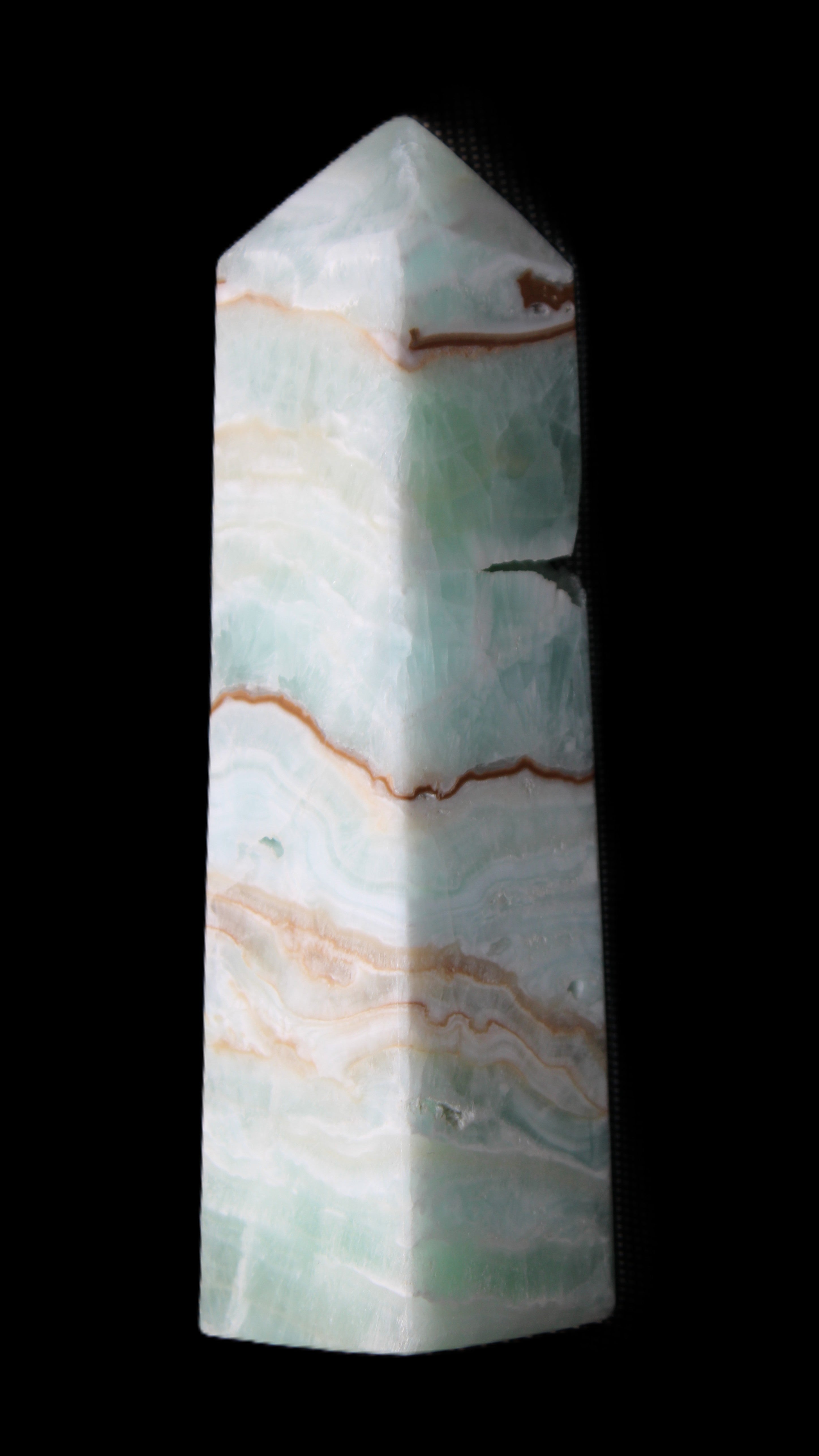 Pistachio Calcite obelisk 134mm 339g in sunlight - Rocks and Things Store
