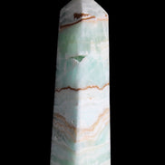Pistachio Calcite obelisk 134mm 339g in sunlight - Rocks and Things Store