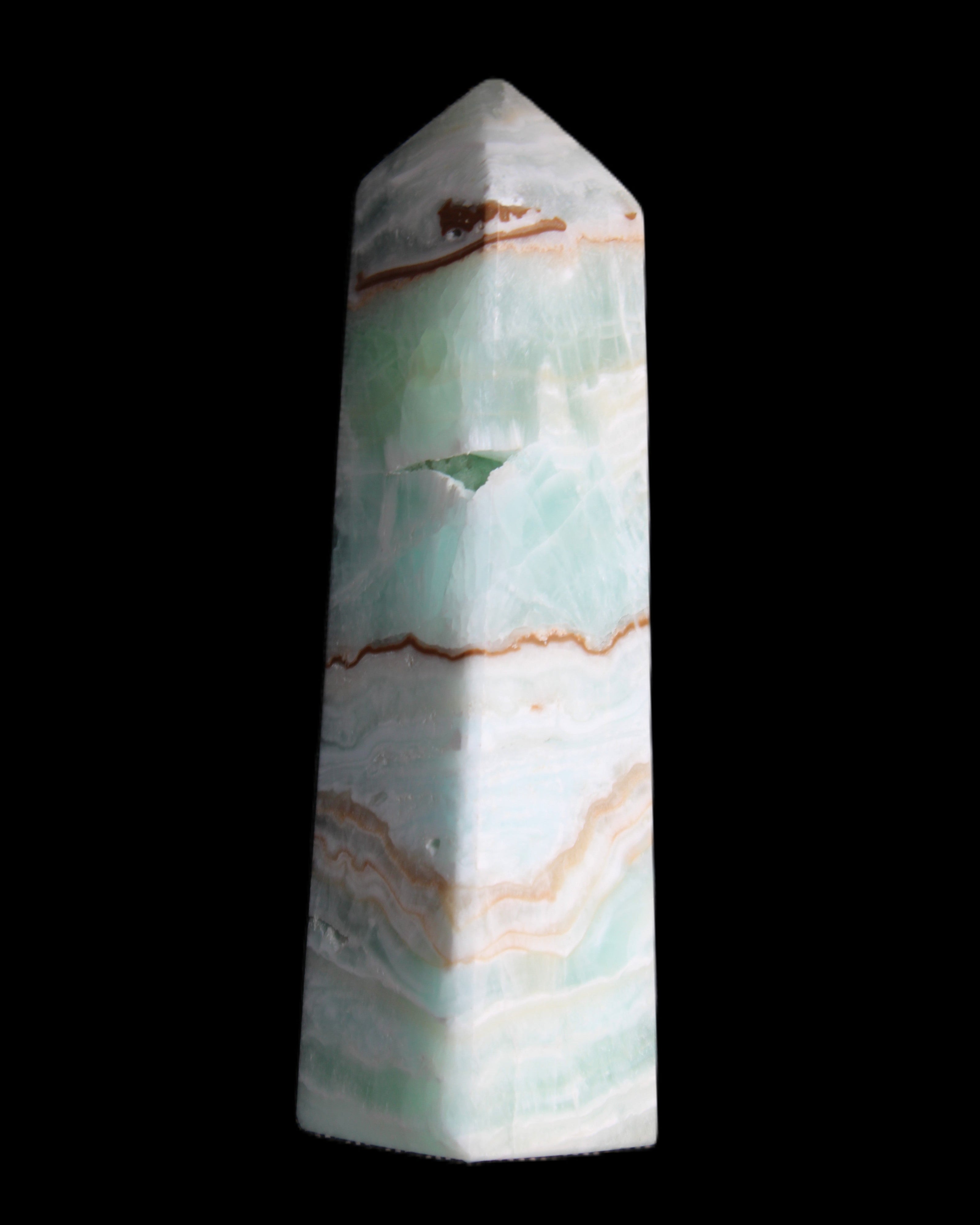 Pistachio Calcite obelisk 134mm 339g in sunlight - Rocks and Things Store