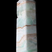 Pistachio Calcite obelisk 134mm 339g in sunlight - Rocks and Things Store