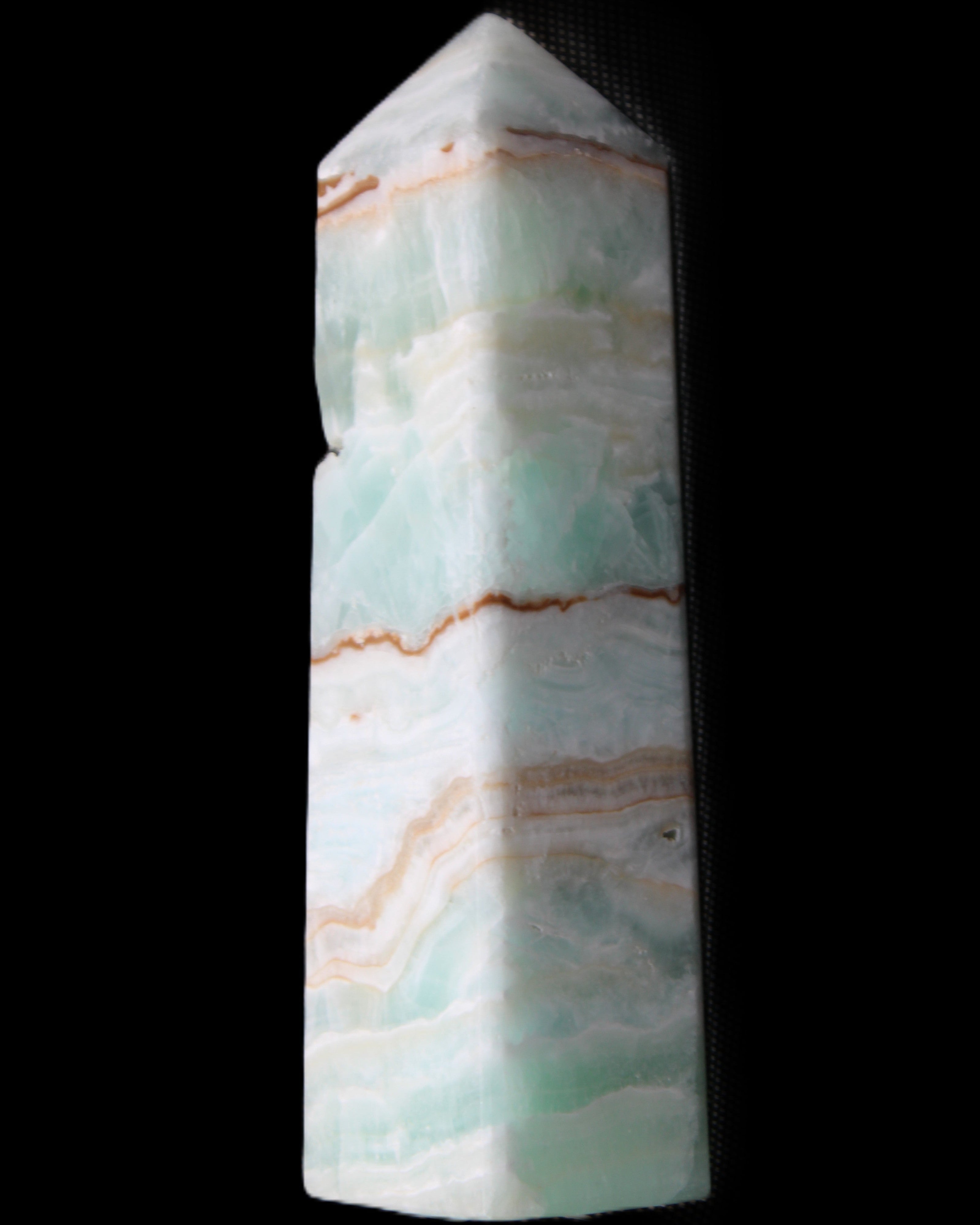 Pistachio Calcite obelisk 134mm 339g in sunlight - Rocks and Things Store