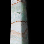 Pistachio Calcite obelisk 134mm 339g in sunlight - Rocks and Things Store