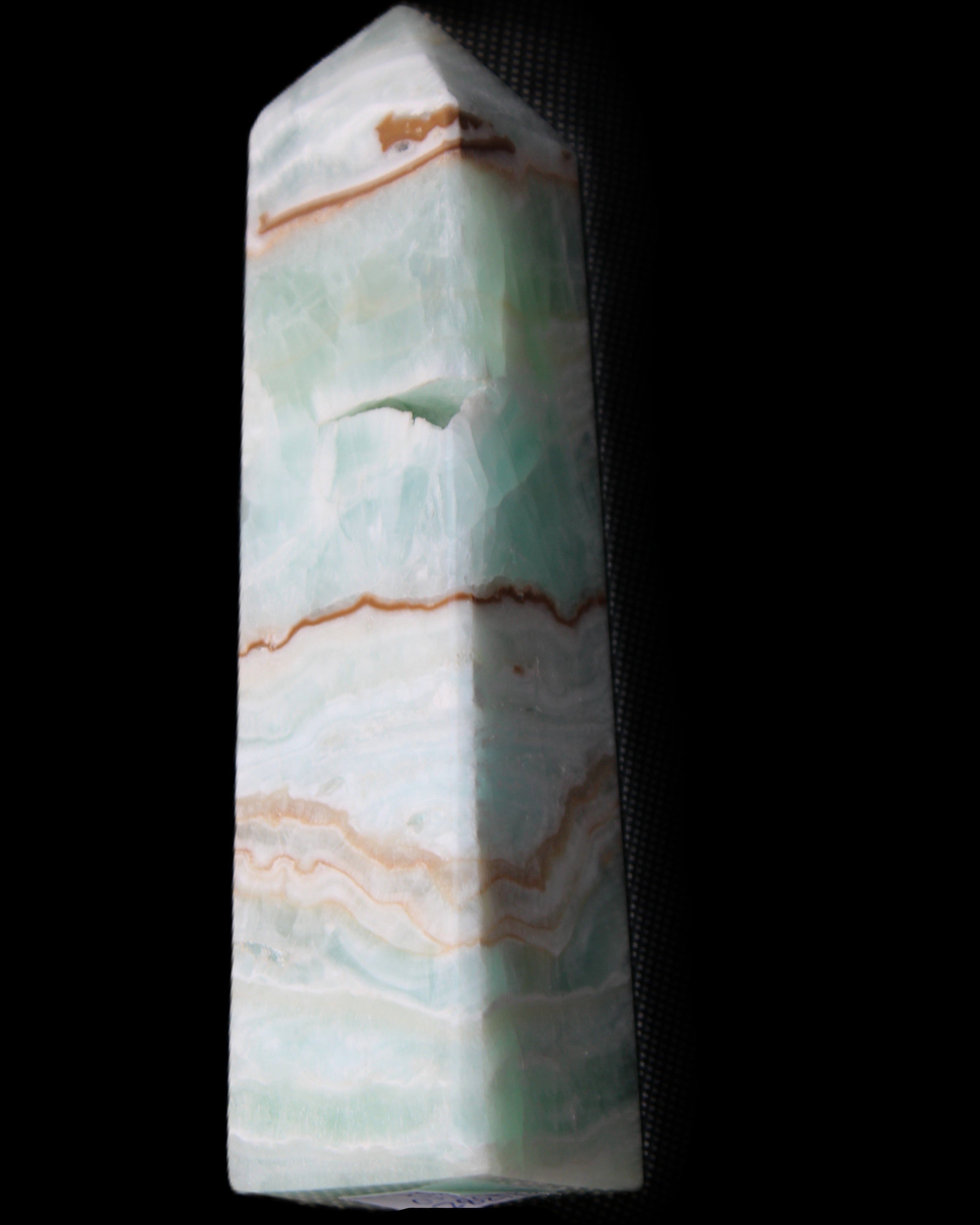 Pistachio Calcite obelisk 134mm 339g in sunlight - Rocks and Things Store