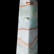 Pistachio Calcite obelisk 134mm 339g in sunlight - Rocks and Things Store