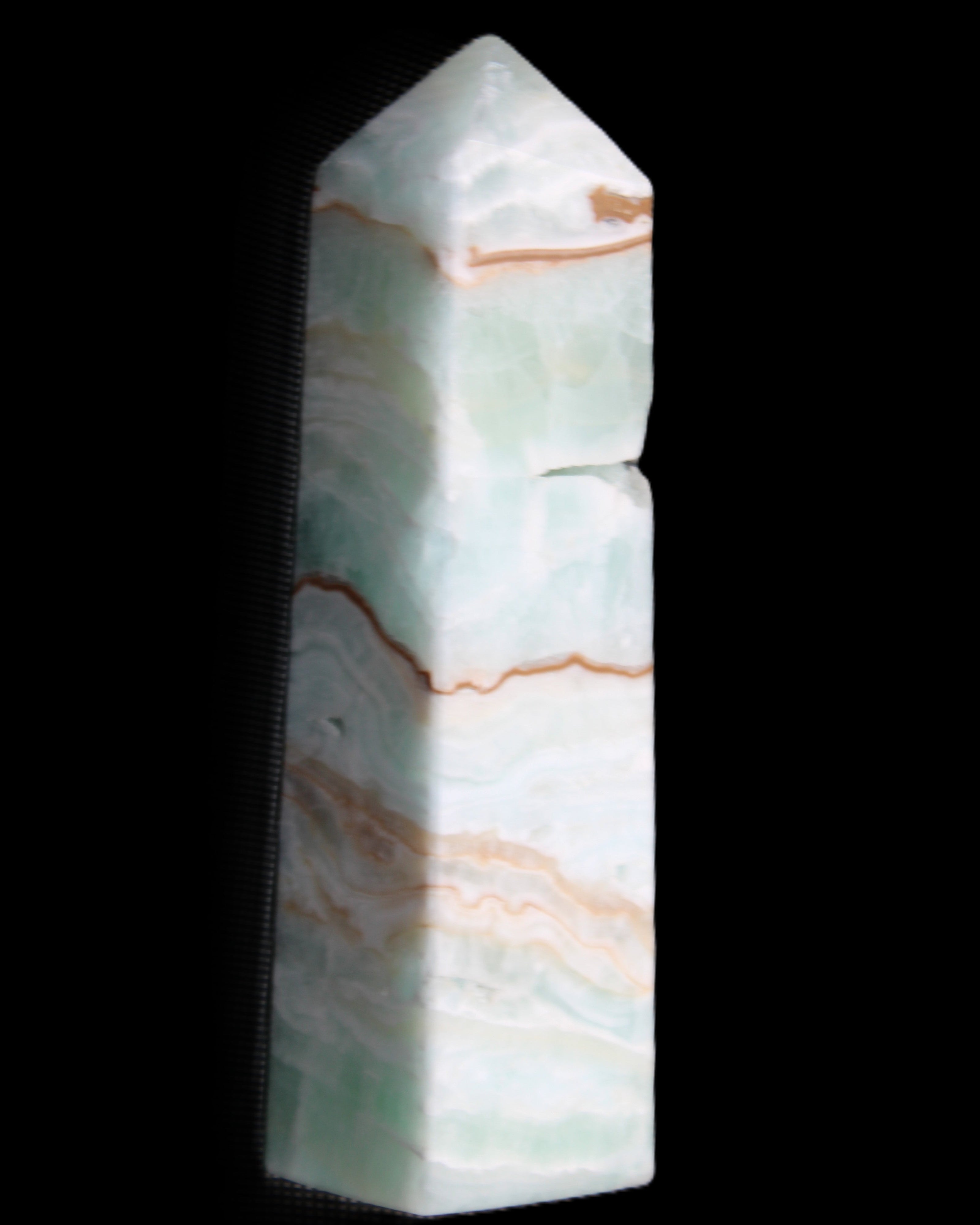 Pistachio Calcite obelisk 134mm 339g in sunlight - Rocks and Things Store