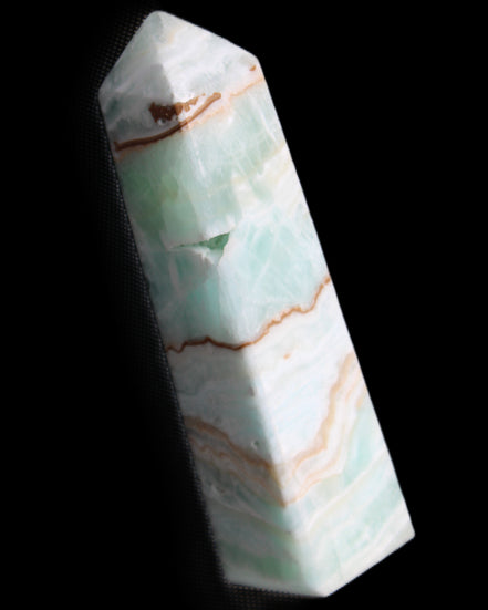 Pistachio Calcite obelisk 134mm 339g in sunlight - Rocks and Things Store