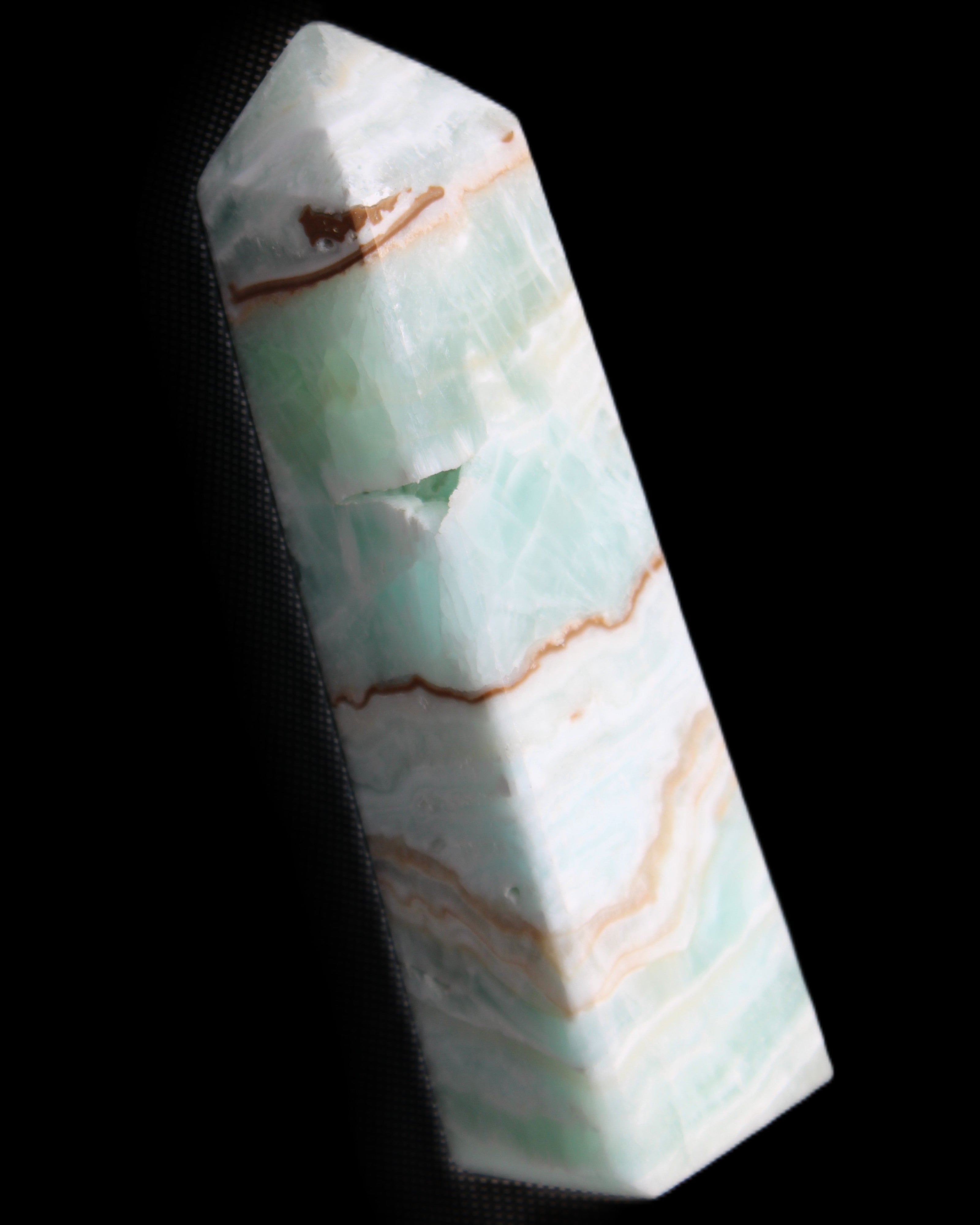 Pistachio Calcite obelisk 134mm 339g in sunlight - Rocks and Things Store