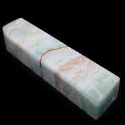 Pistachio Calcite obelisk 134mm 339g in sunlight - Rocks and Things Store