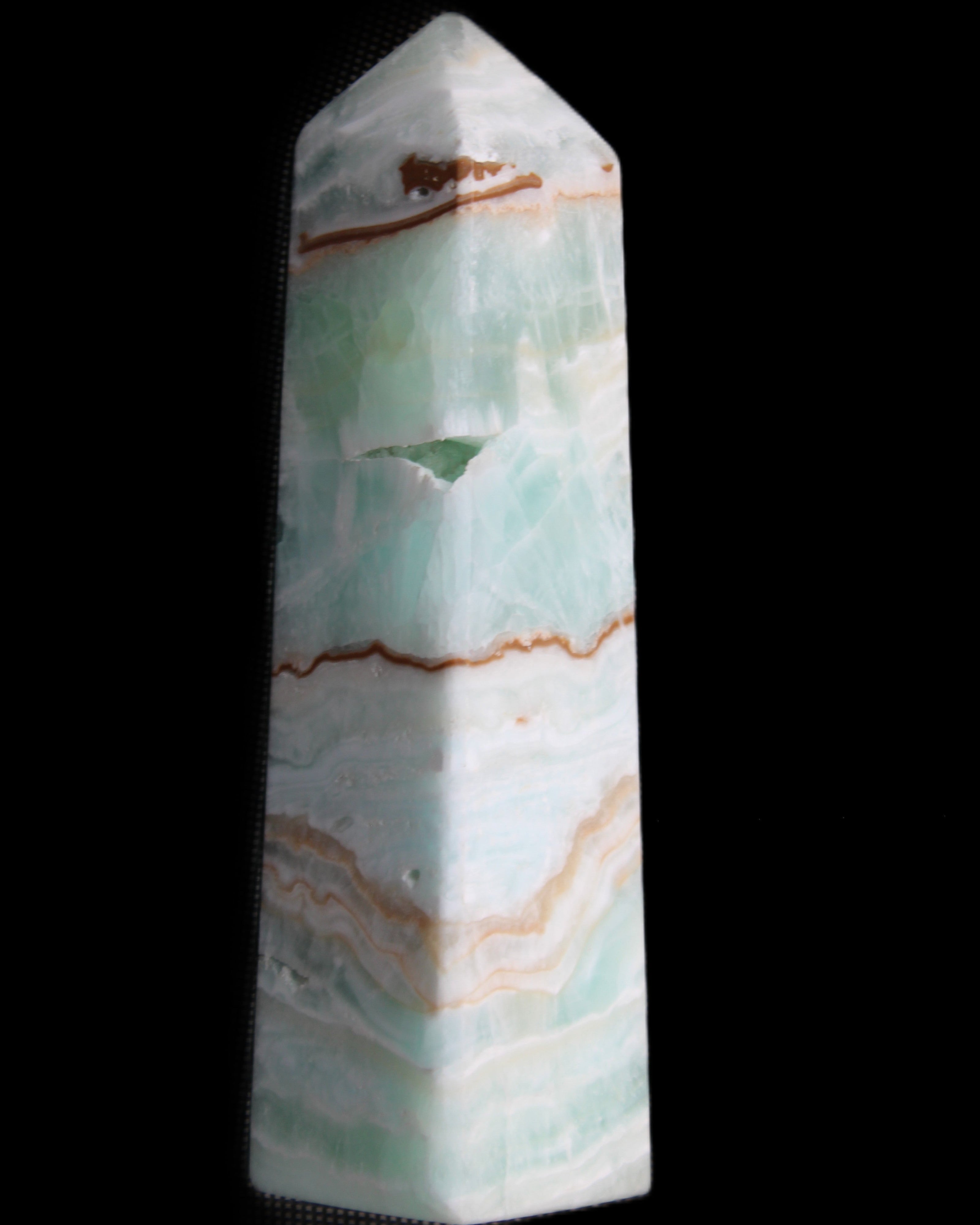 Pistachio Calcite obelisk 134mm 339g in sunlight - Rocks and Things Store