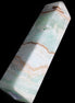 Pistachio Calcite obelisk 134mm 339g in sunlight - Rocks and Things Store