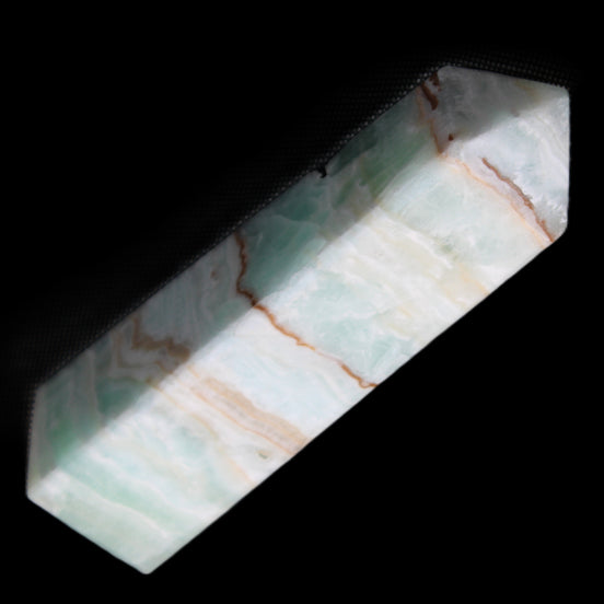 Pistachio Calcite obelisk 134mm 339g in sunlight - Rocks and Things Store