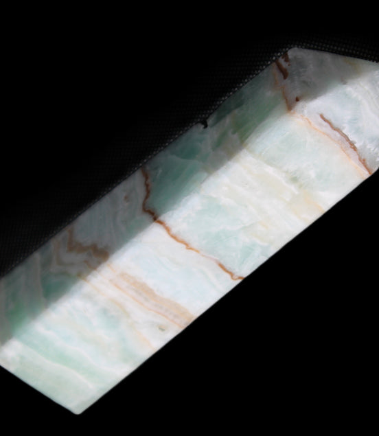 Pistachio Calcite obelisk 134mm 339g in sunlight - Rocks and Things Store