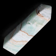 Pistachio Calcite obelisk 134mm 339g in sunlight - Rocks and Things Store