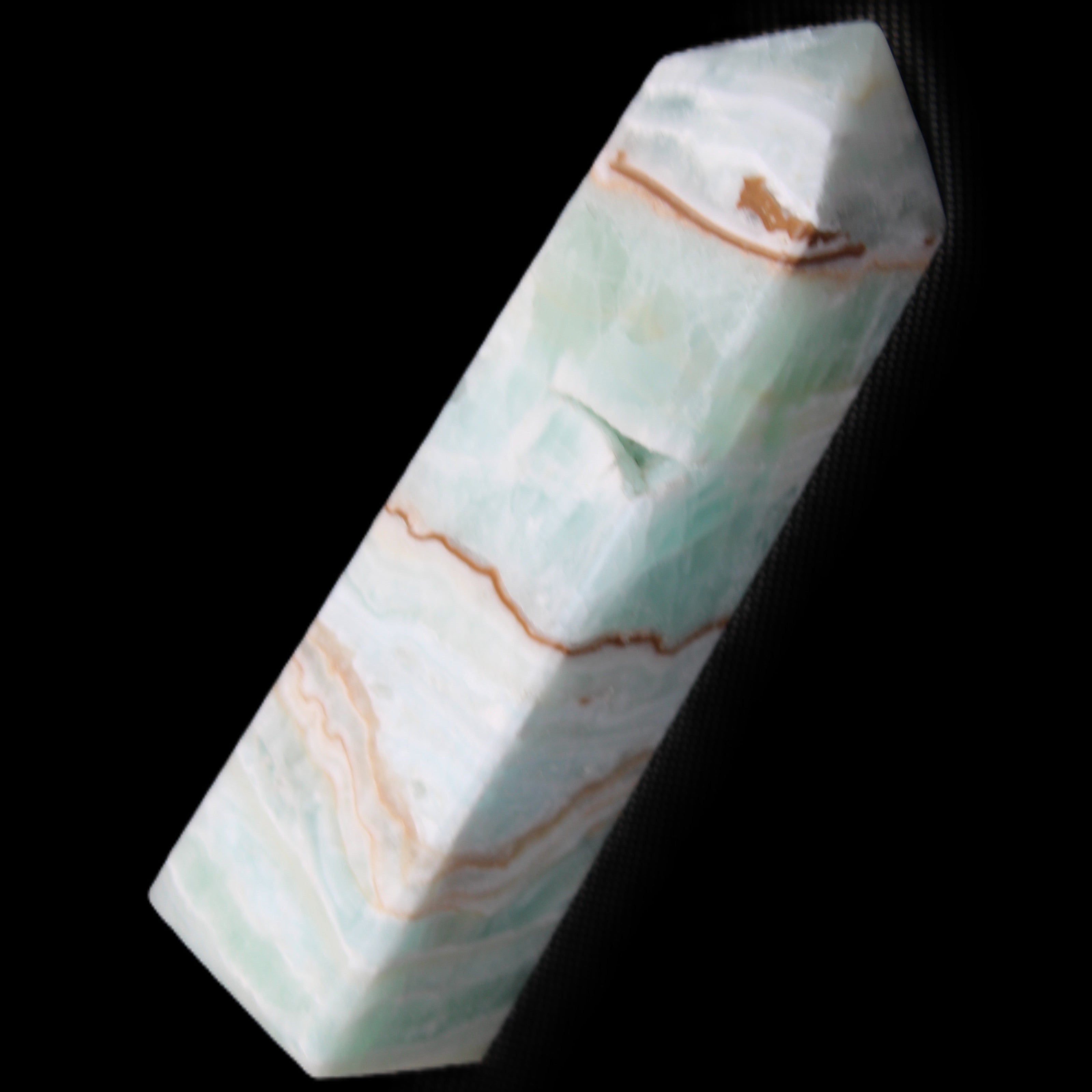 Pistachio Calcite obelisk 134mm 339g in sunlight - Rocks and Things Store
