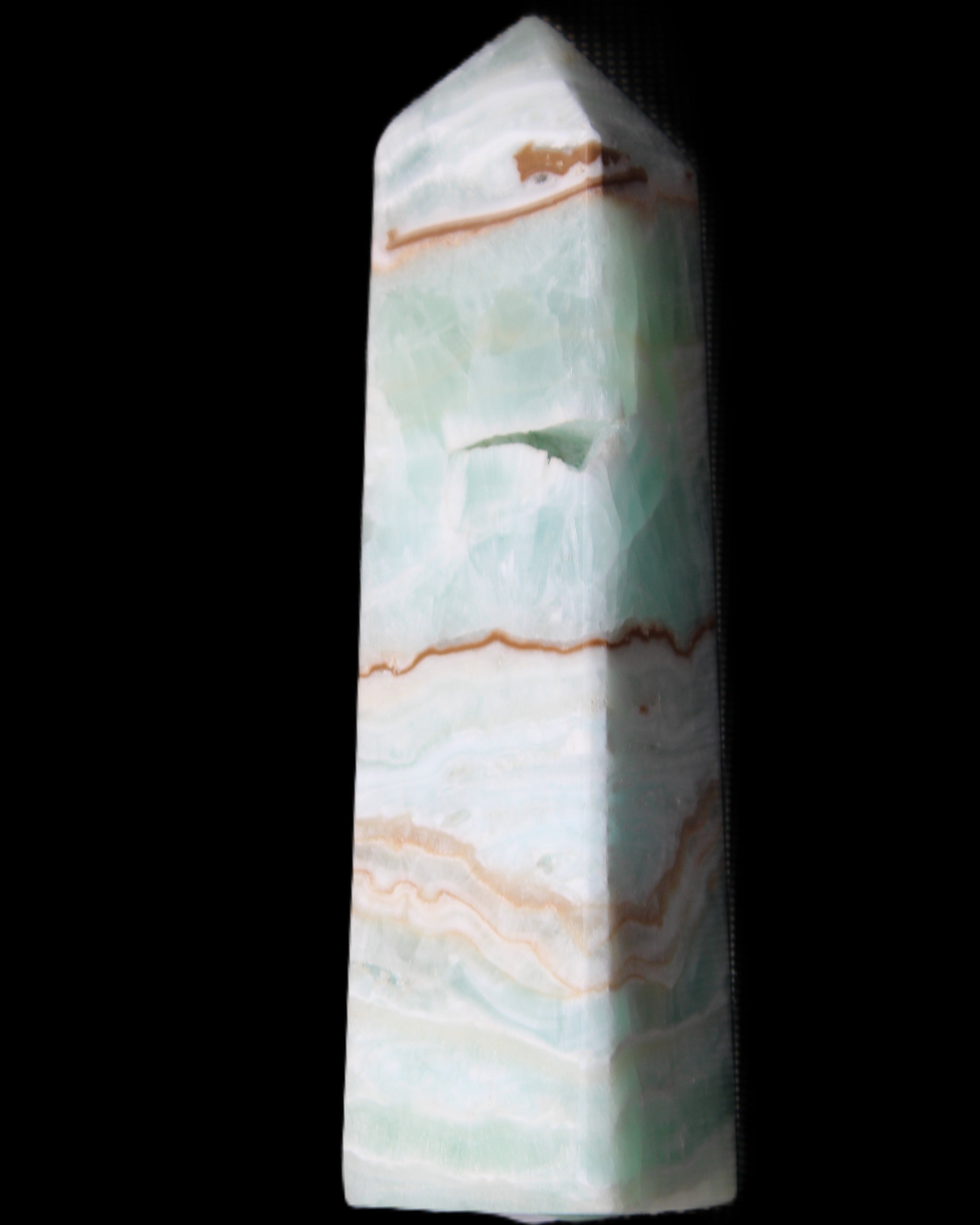 Pistachio Calcite obelisk 134mm 339g in sunlight - Rocks and Things Store