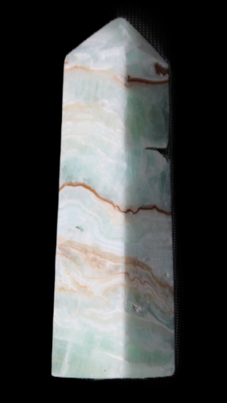 Pistachio Calcite obelisk 134mm 339g in sunlight - Rocks and Things Store