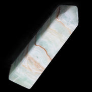 Pistachio Calcite obelisk 134mm 339g in sunlight - Rocks and Things Store