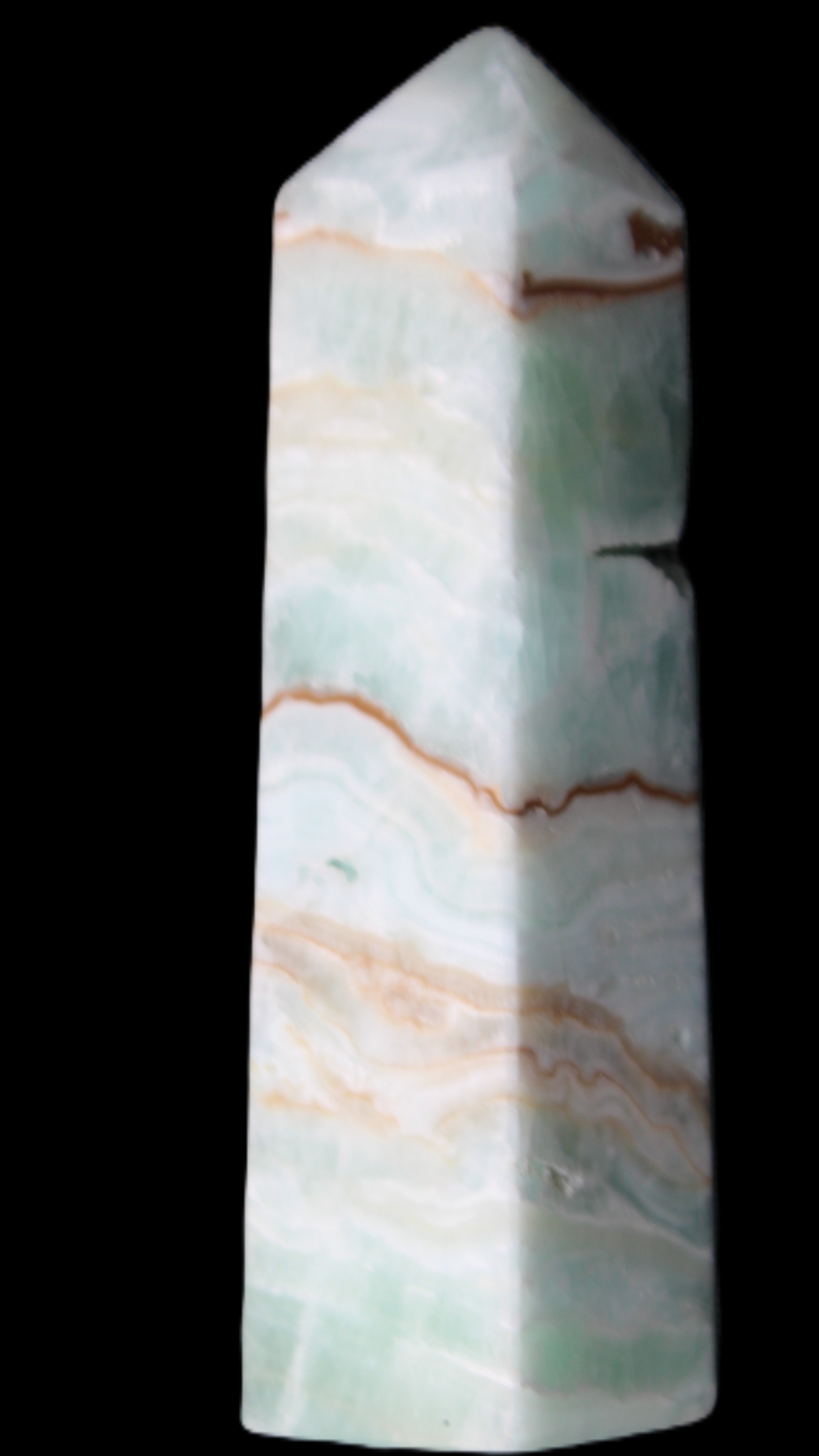 Pistachio Calcite obelisk 134mm 339g in sunlight - Rocks and Things Store
