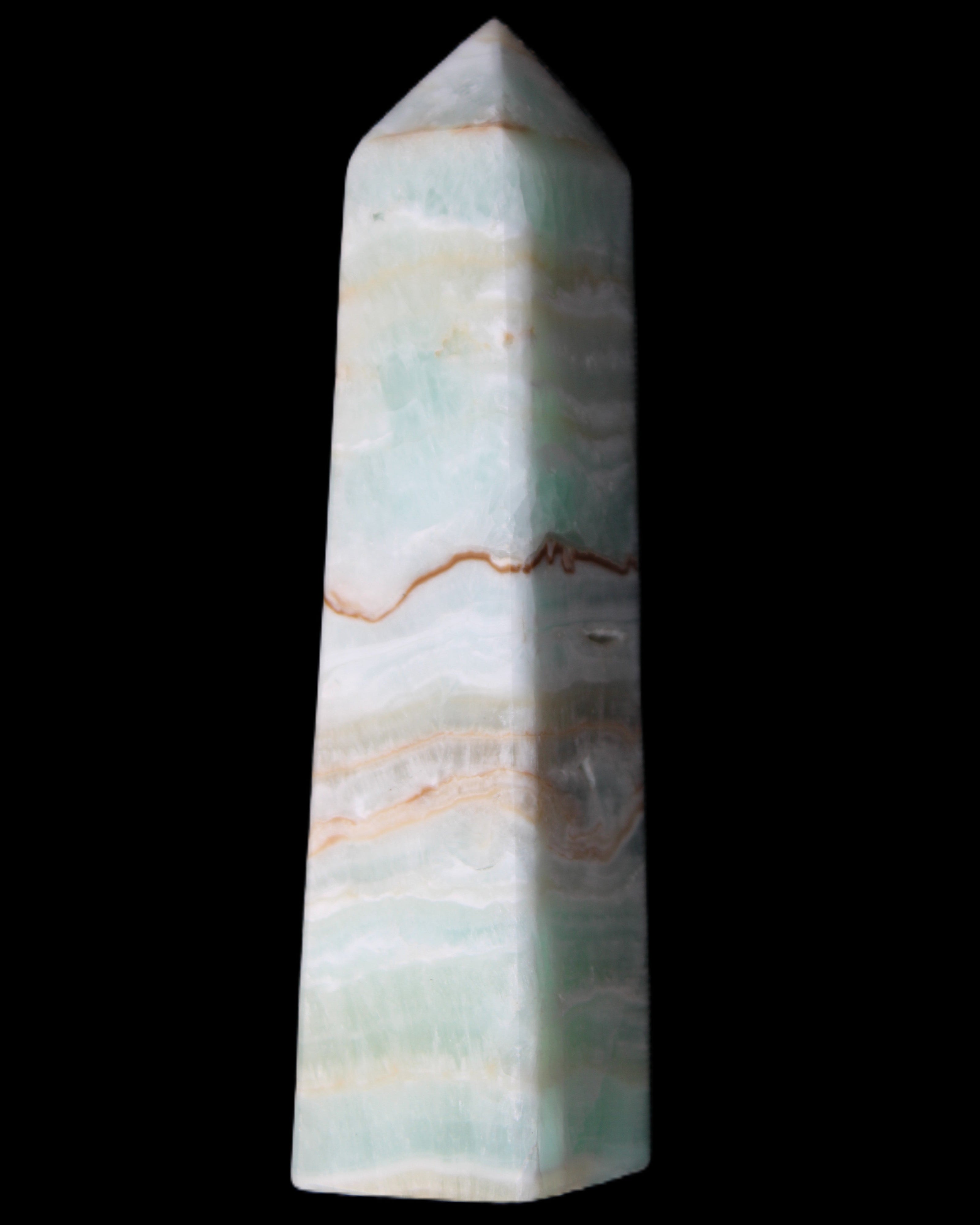 Pistachio Calcite obelisk 132mm 304g in sunlight - Rocks and Things Store