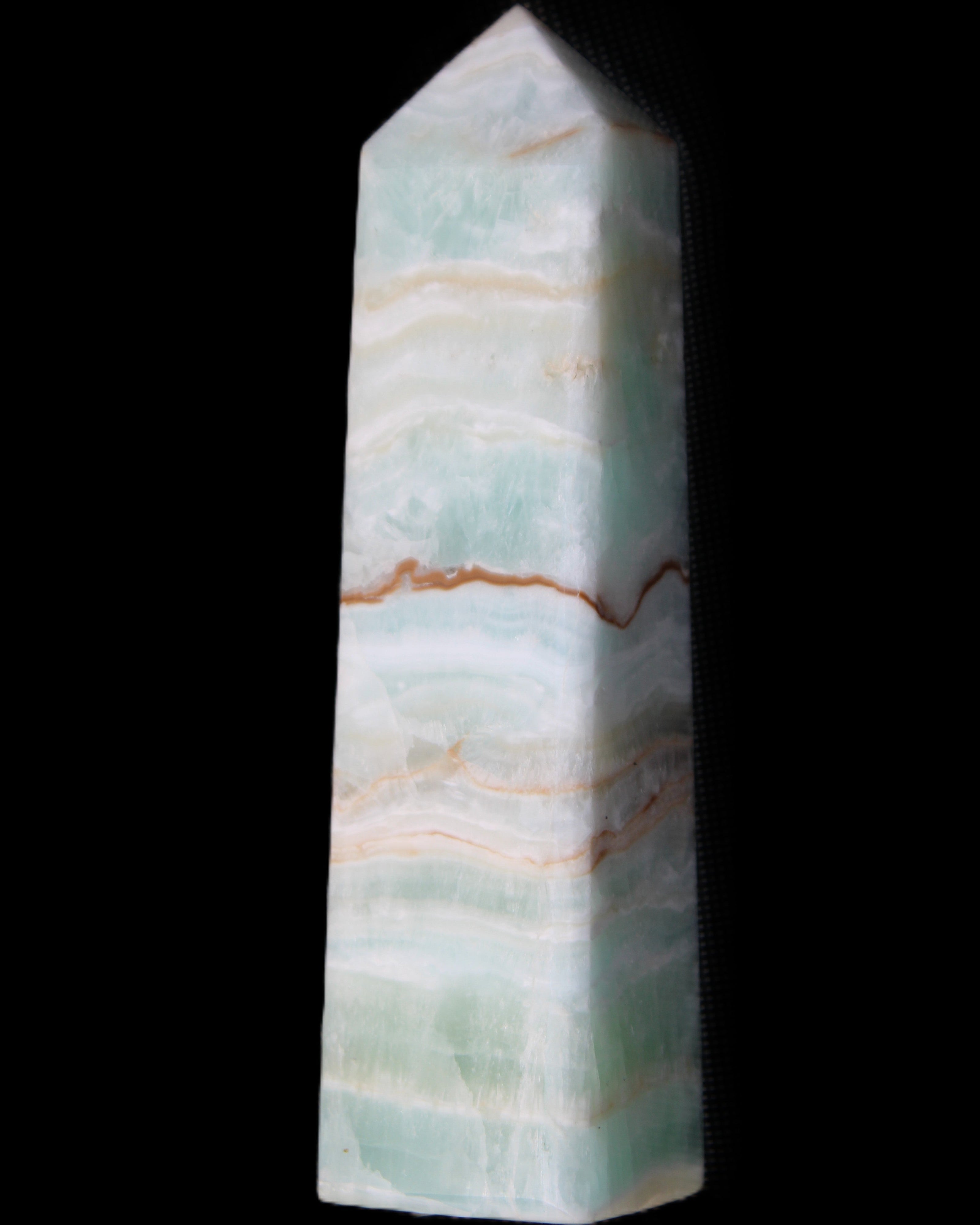 Pistachio Calcite obelisk 132mm 304g in sunlight - Rocks and Things Store