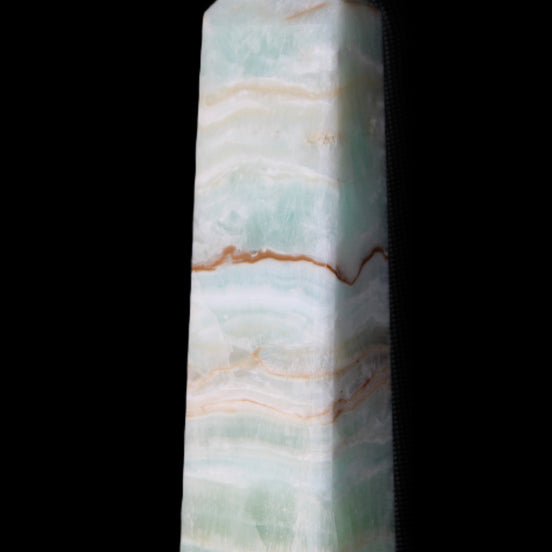 Pistachio Calcite obelisk 132mm 304g in sunlight - Rocks and Things Store