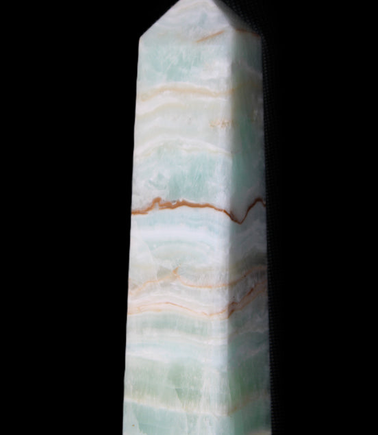 Pistachio Calcite obelisk 132mm 304g in sunlight - Rocks and Things Store