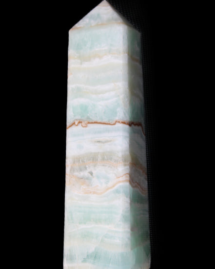 Pistachio Calcite obelisk 132mm 304g in sunlight - Rocks and Things Store