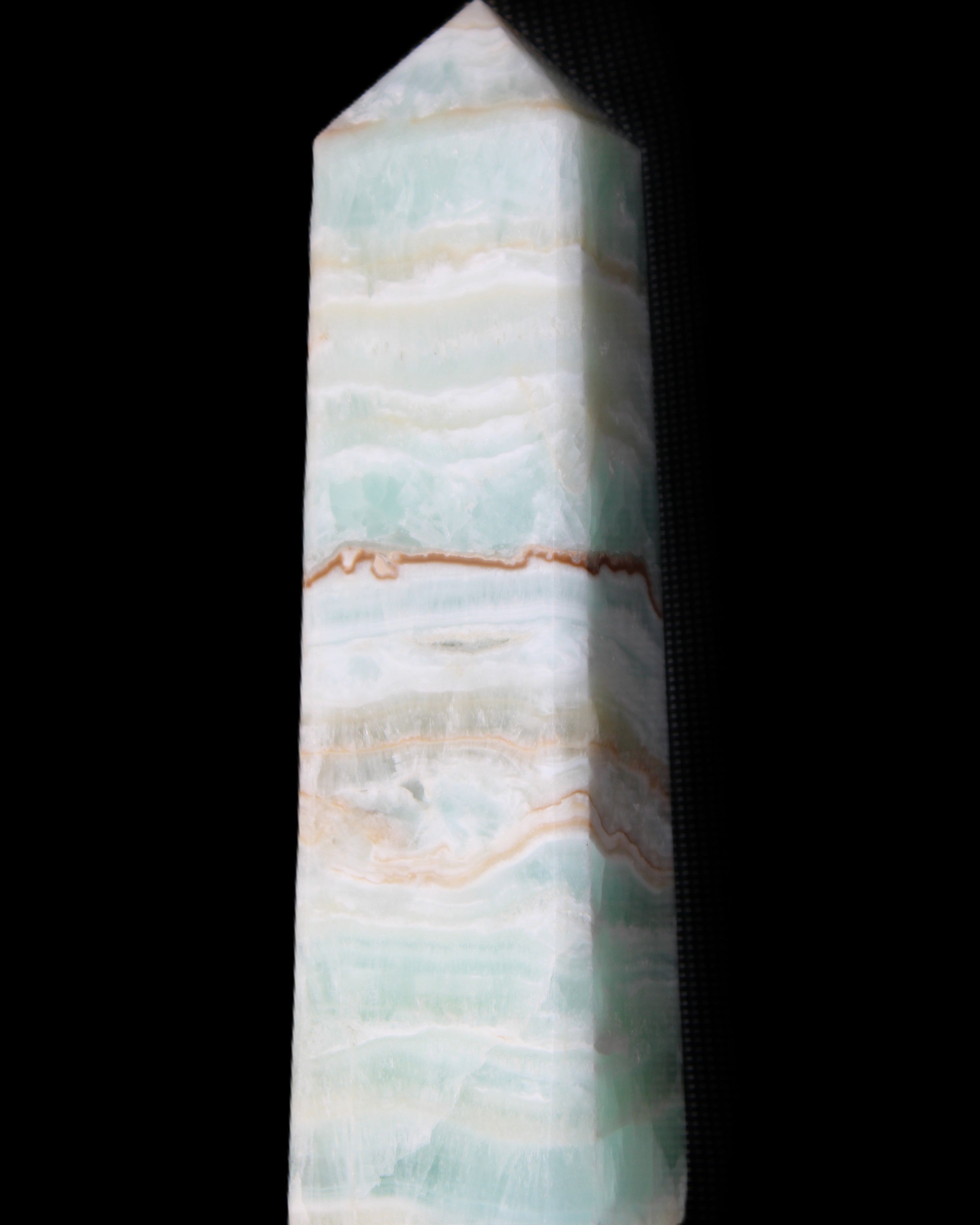 Pistachio Calcite obelisk 132mm 304g in sunlight - Rocks and Things Store