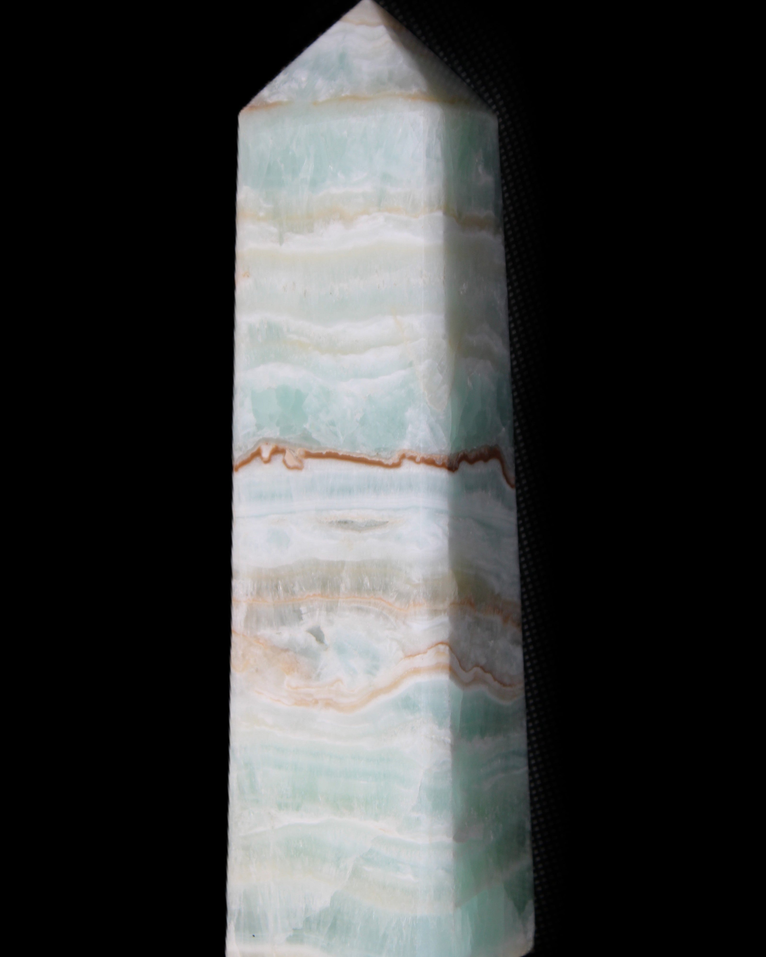 Pistachio Calcite obelisk 132mm 304g in sunlight - Rocks and Things Store