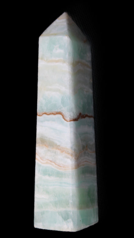 Pistachio Calcite obelisk 132mm 304g in sunlight - Rocks and Things Store