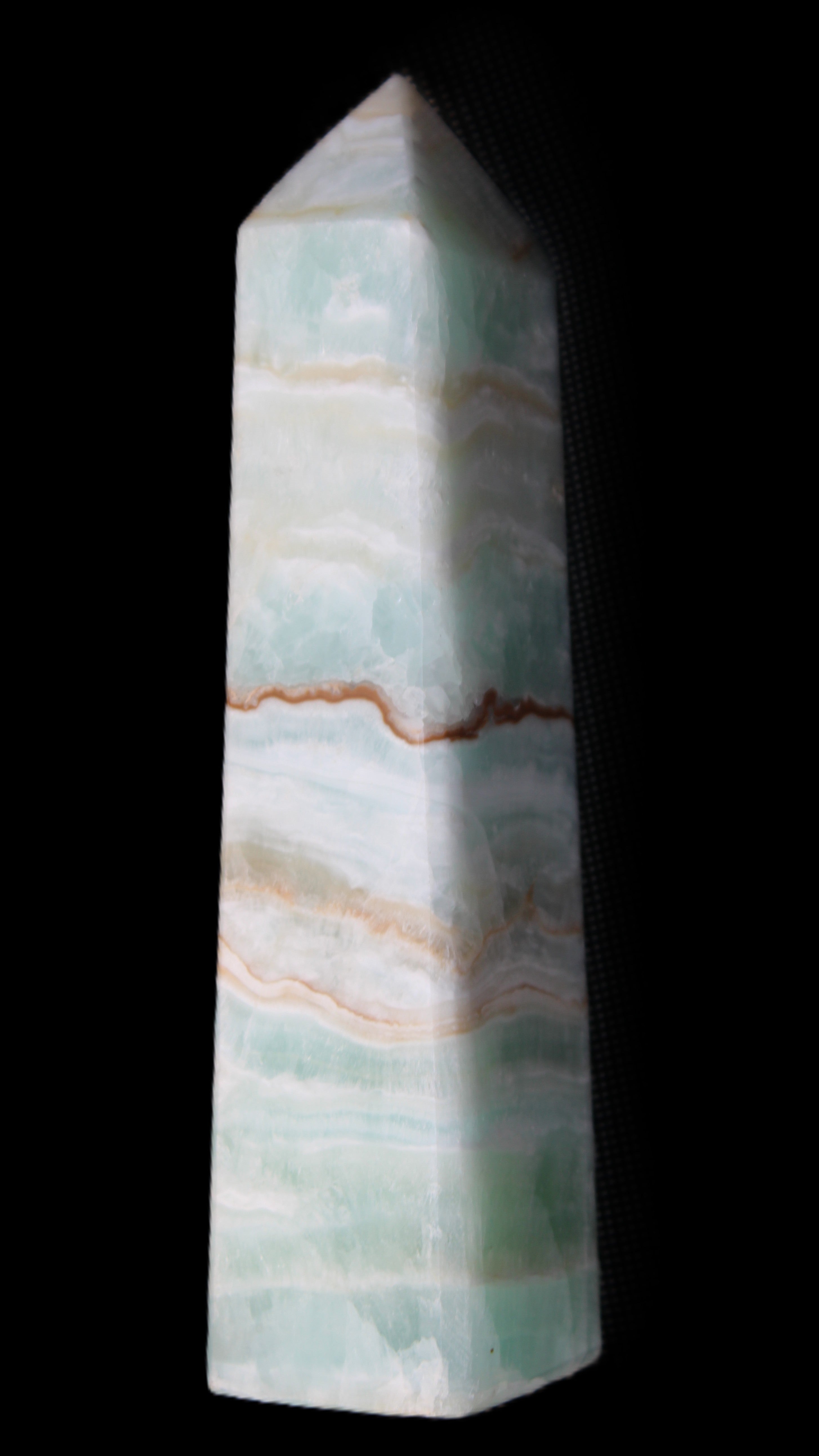 Pistachio Calcite obelisk 132mm 304g in sunlight - Rocks and Things Store