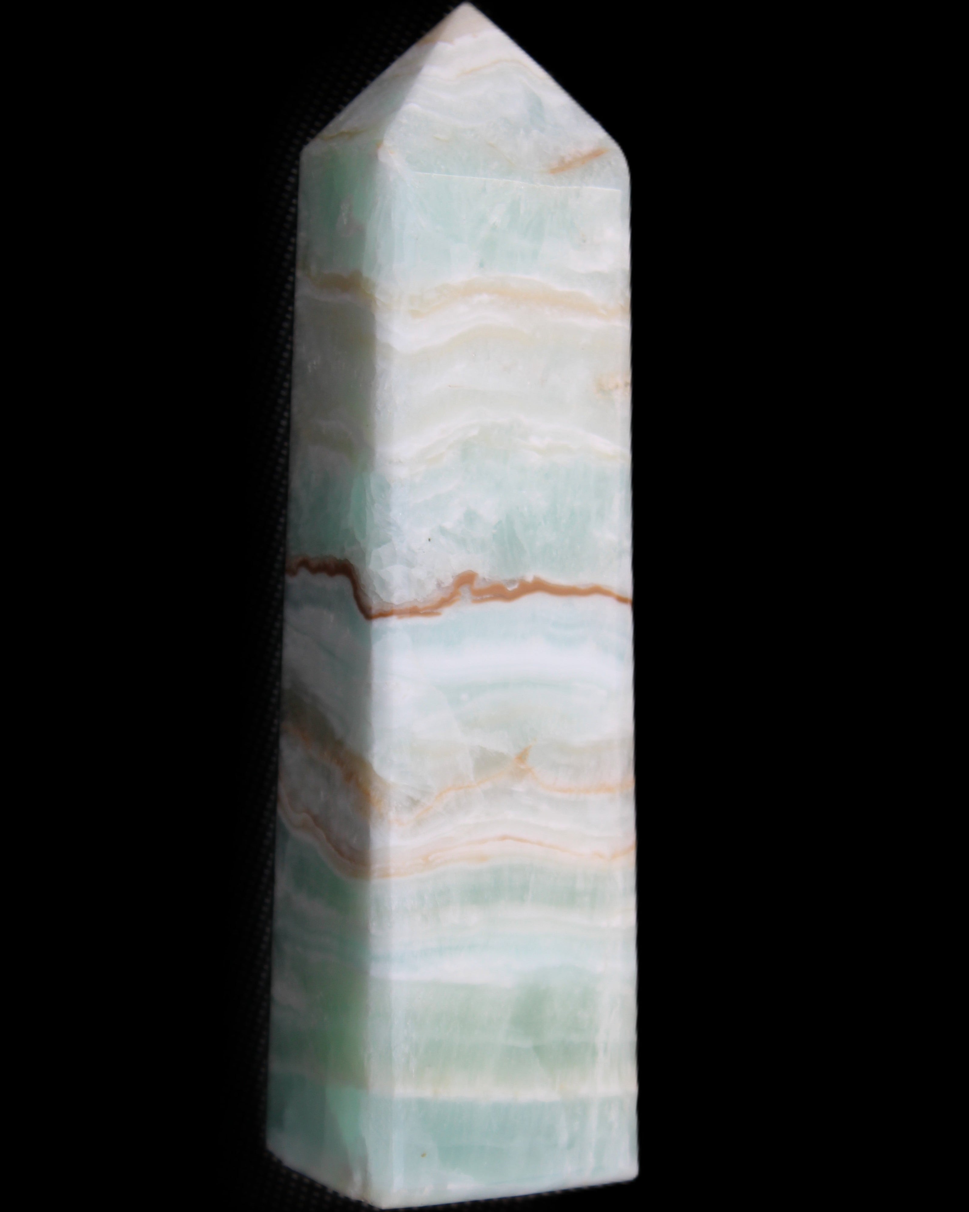 Pistachio Calcite obelisk 132mm 304g in sunlight - Rocks and Things Store
