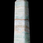 Pistachio Calcite obelisk 132mm 304g in sunlight - Rocks and Things Store