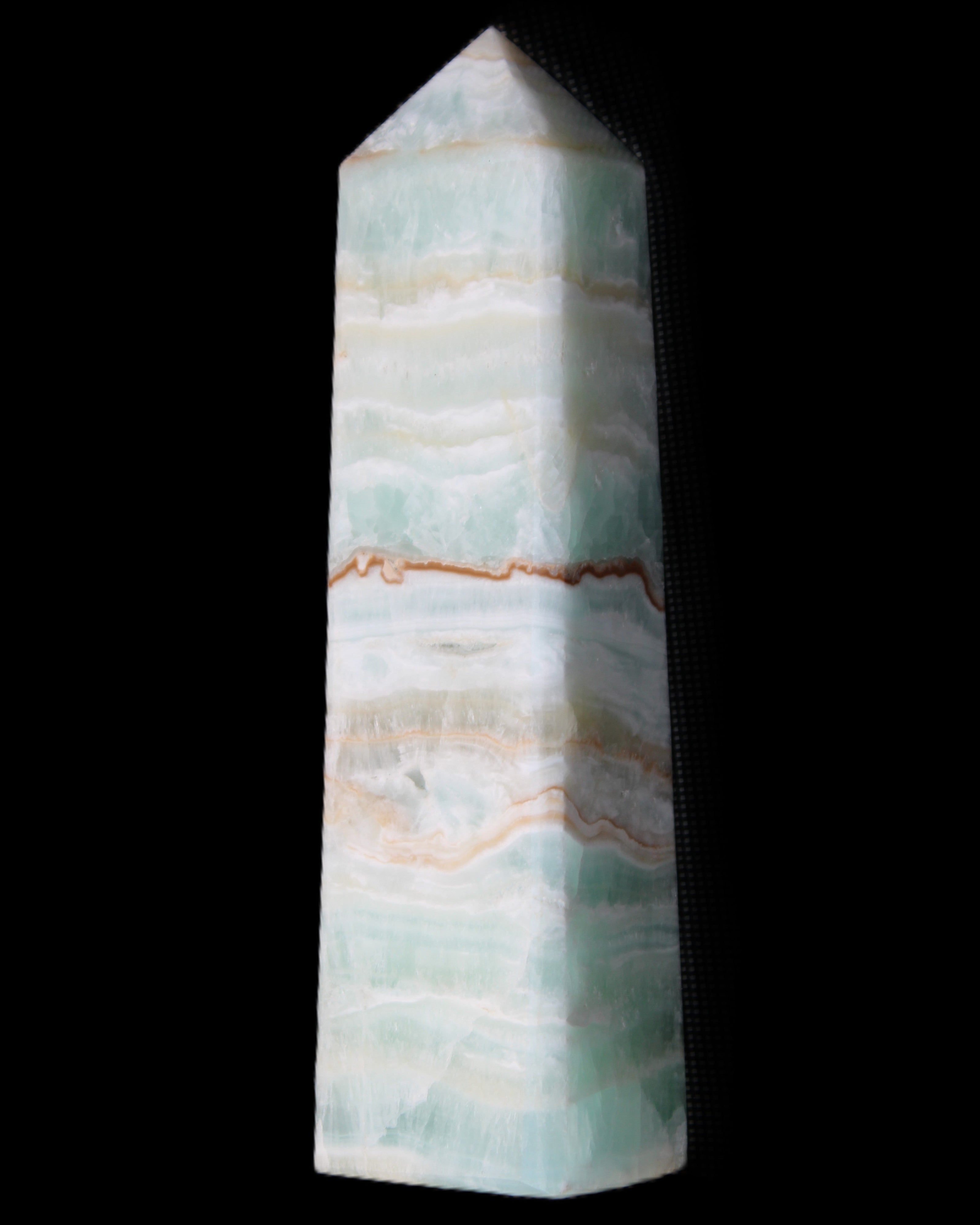 Pistachio Calcite obelisk 132mm 304g in sunlight - Rocks and Things Store