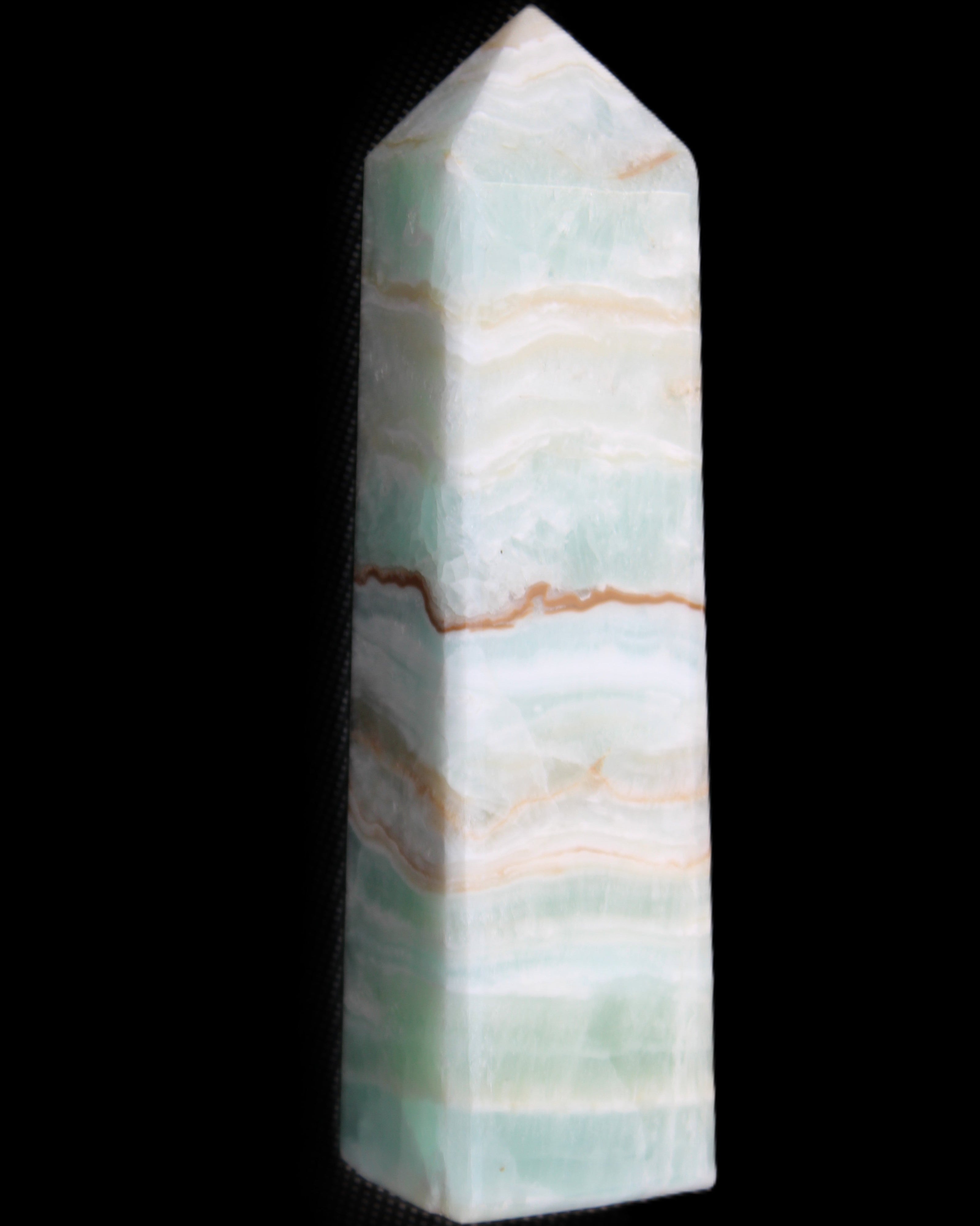 Pistachio Calcite obelisk 132mm 304g in sunlight - Rocks and Things Store