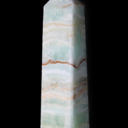 Pistachio Calcite obelisk 132mm 304g in sunlight - Rocks and Things Store