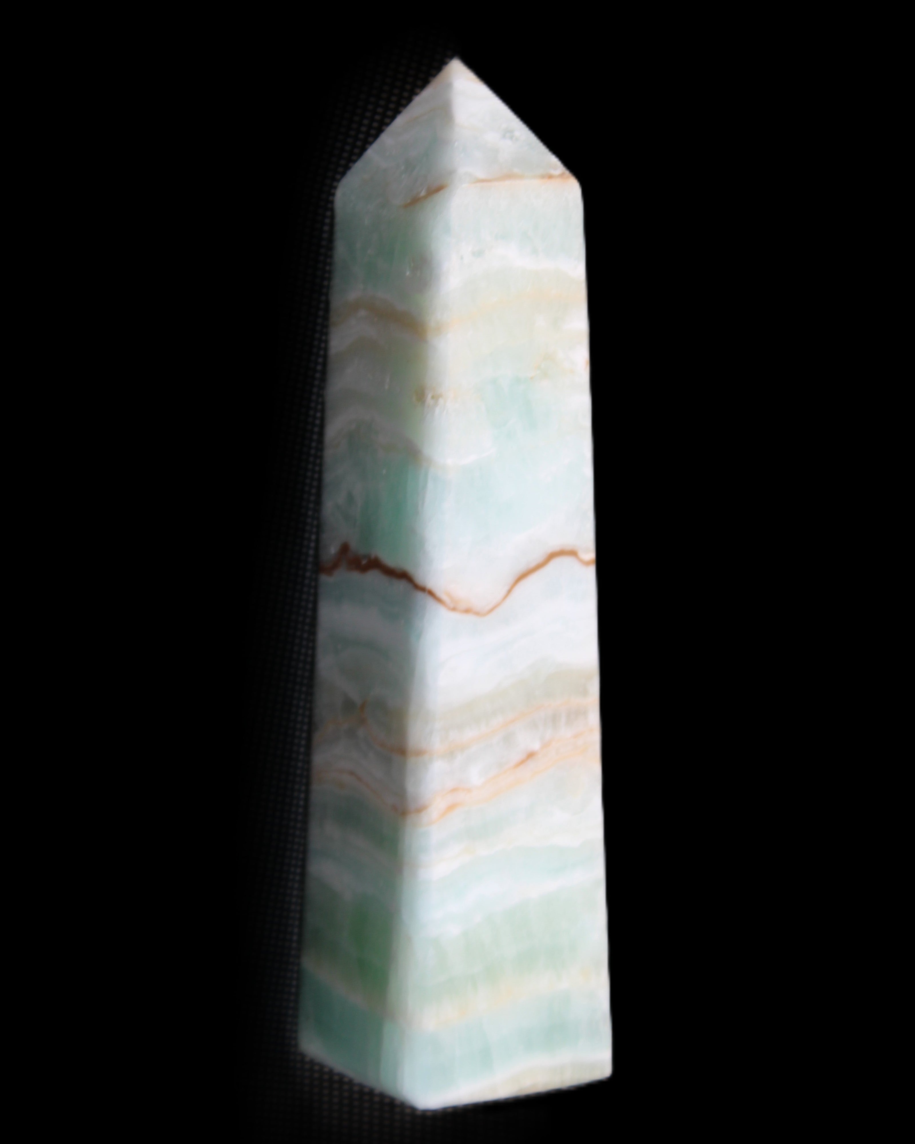 Pistachio Calcite obelisk 132mm 304g in sunlight - Rocks and Things Store