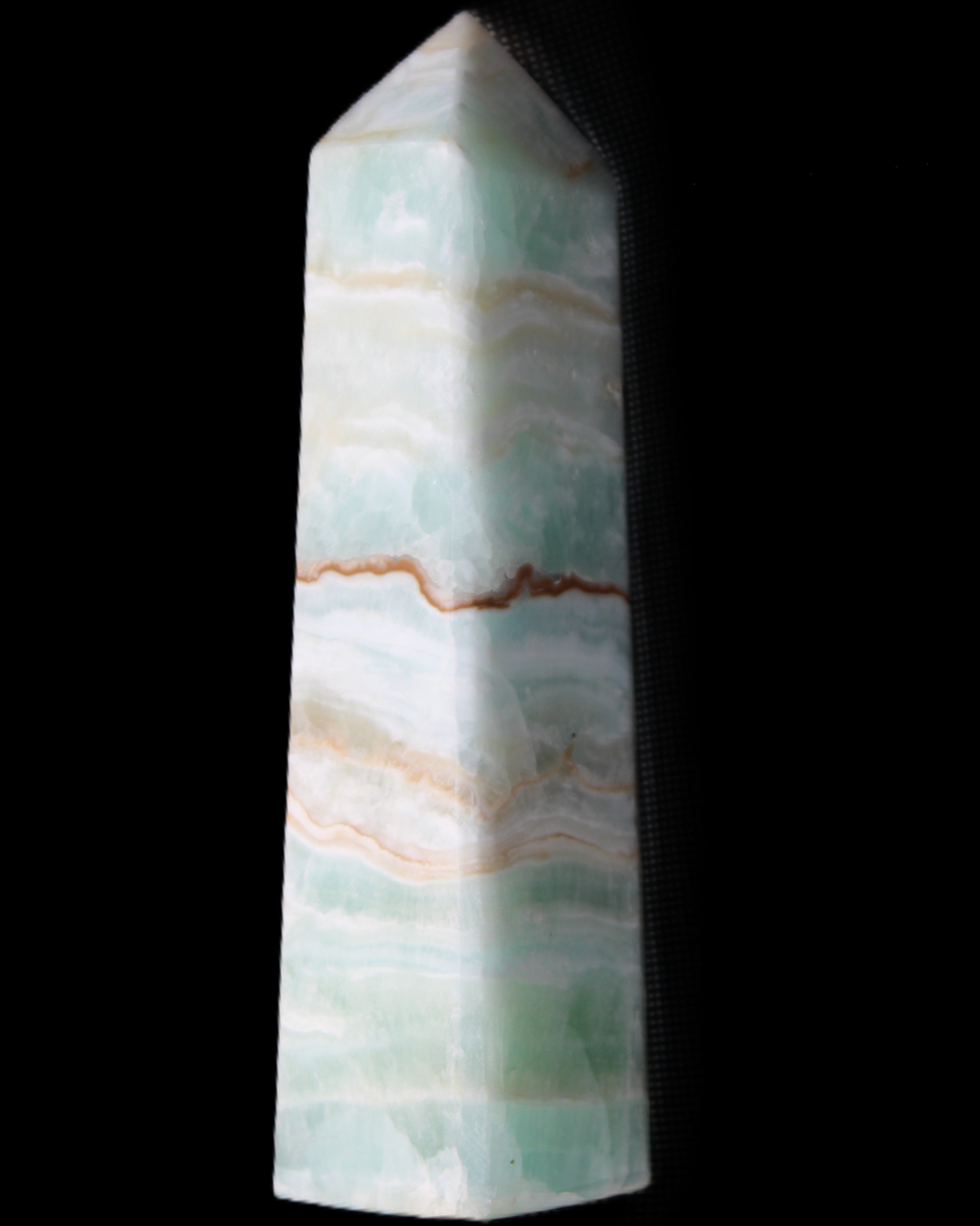 Pistachio Calcite obelisk 132mm 304g in sunlight - Rocks and Things Store