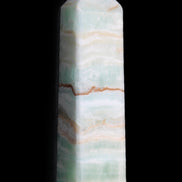 Pistachio Calcite obelisk 132mm 304g in sunlight - Rocks and Things Store