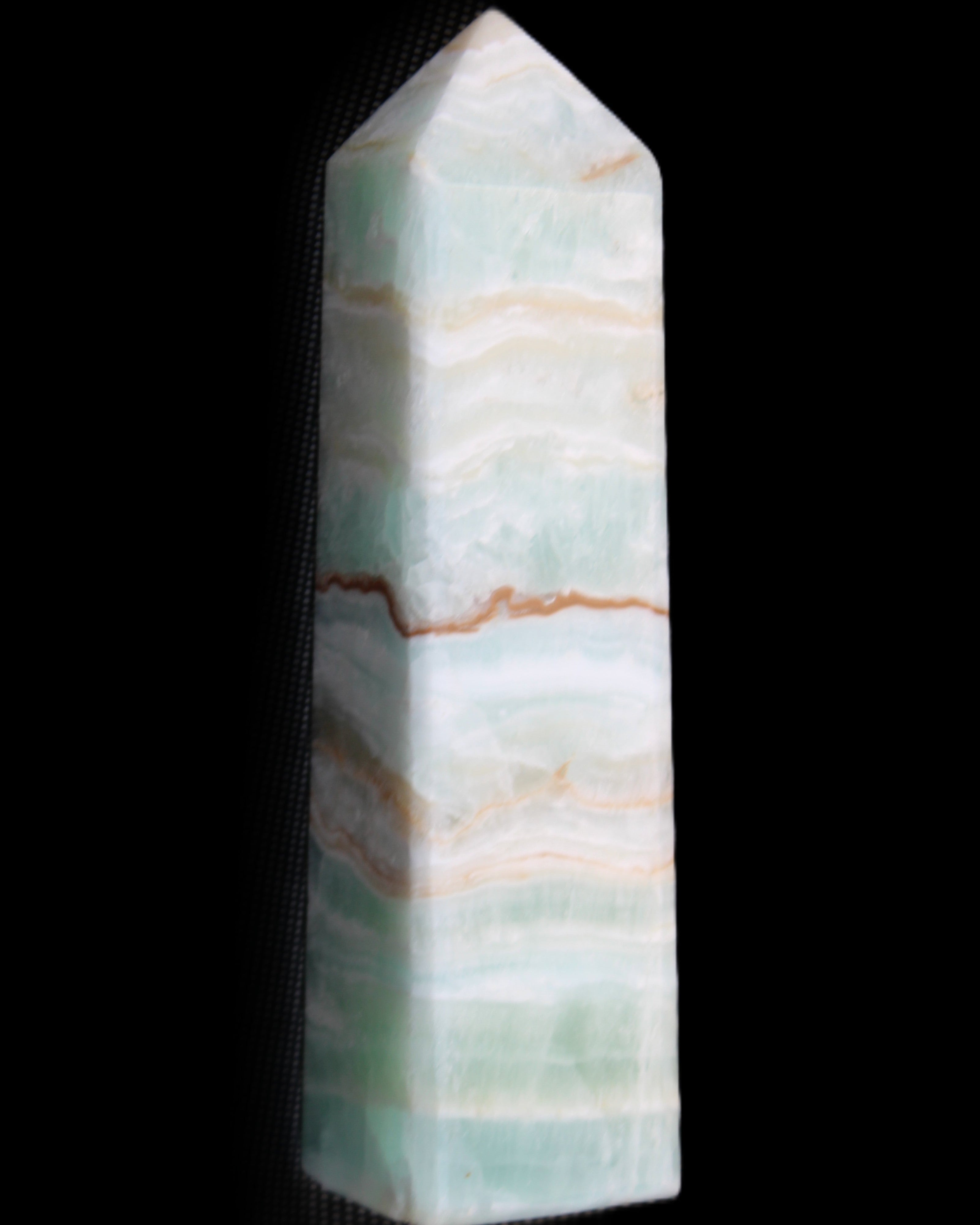 Pistachio Calcite obelisk 132mm 304g in sunlight - Rocks and Things Store