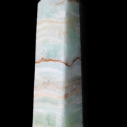 Pistachio Calcite obelisk 132mm 304g in sunlight - Rocks and Things Store