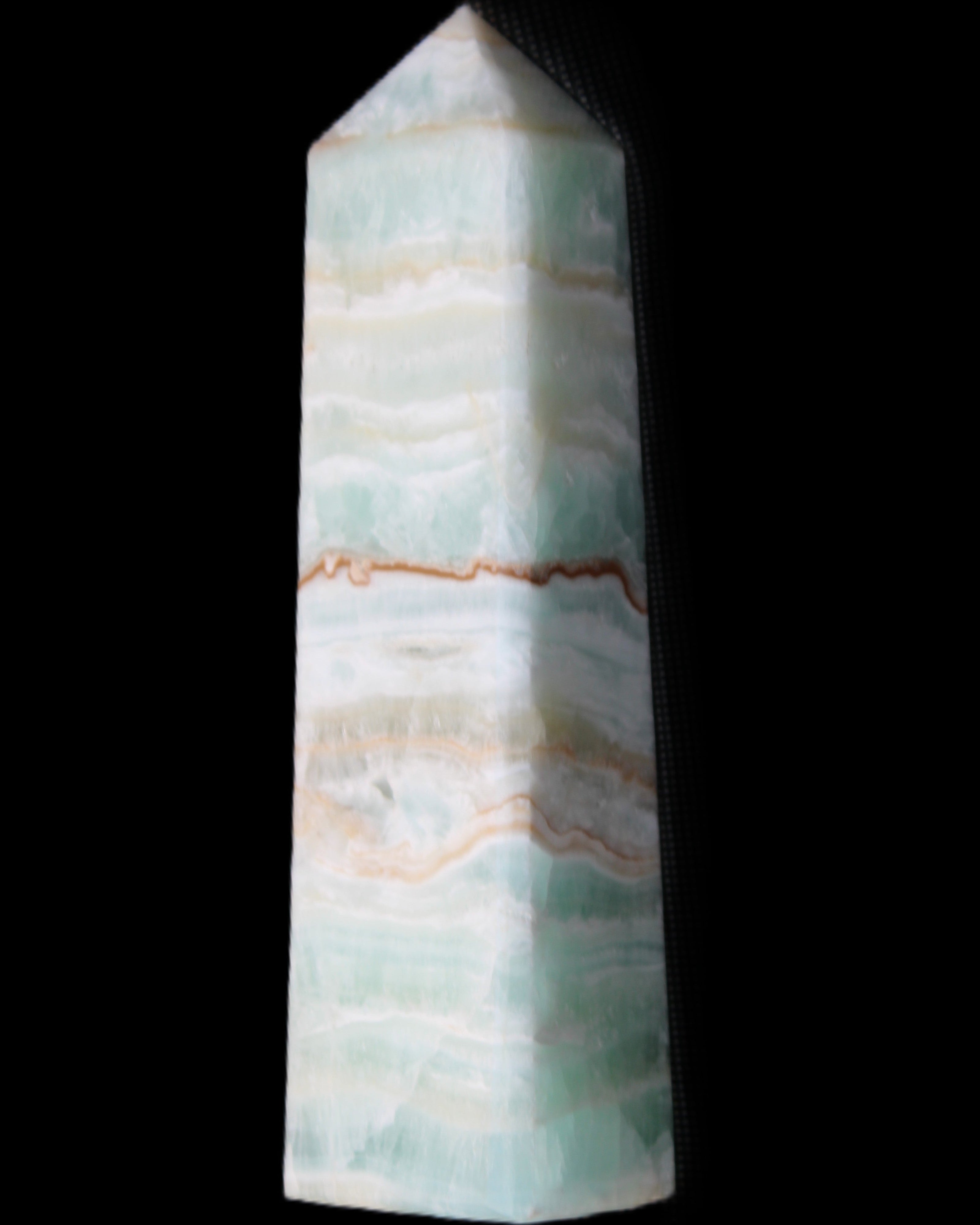 Pistachio Calcite obelisk 132mm 304g in sunlight - Rocks and Things Store