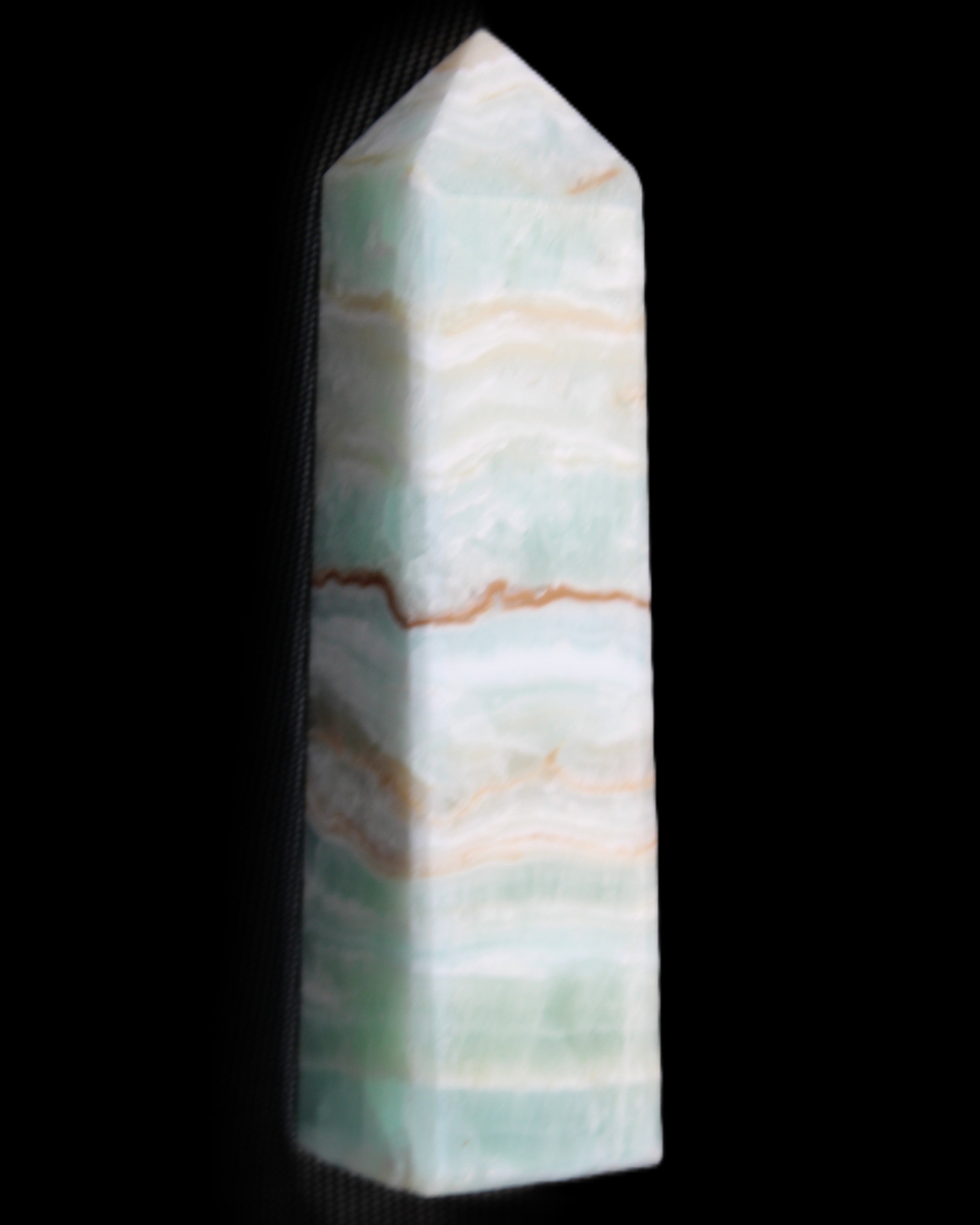 Pistachio Calcite obelisk 132mm 304g in sunlight - Rocks and Things Store