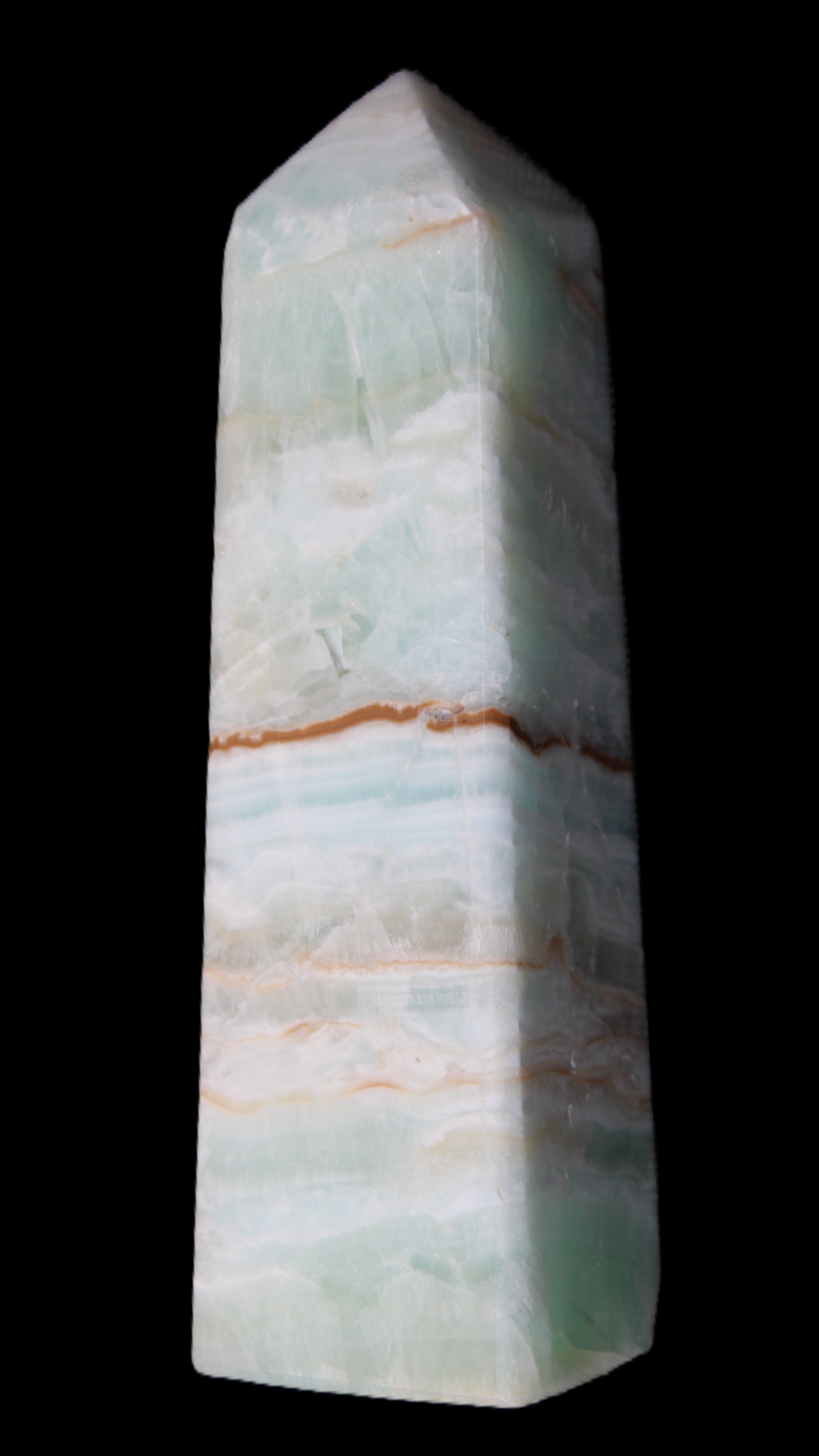 Pistachio Calcite obelisk 122mm 290g in sunlight - Rocks and Things Store
