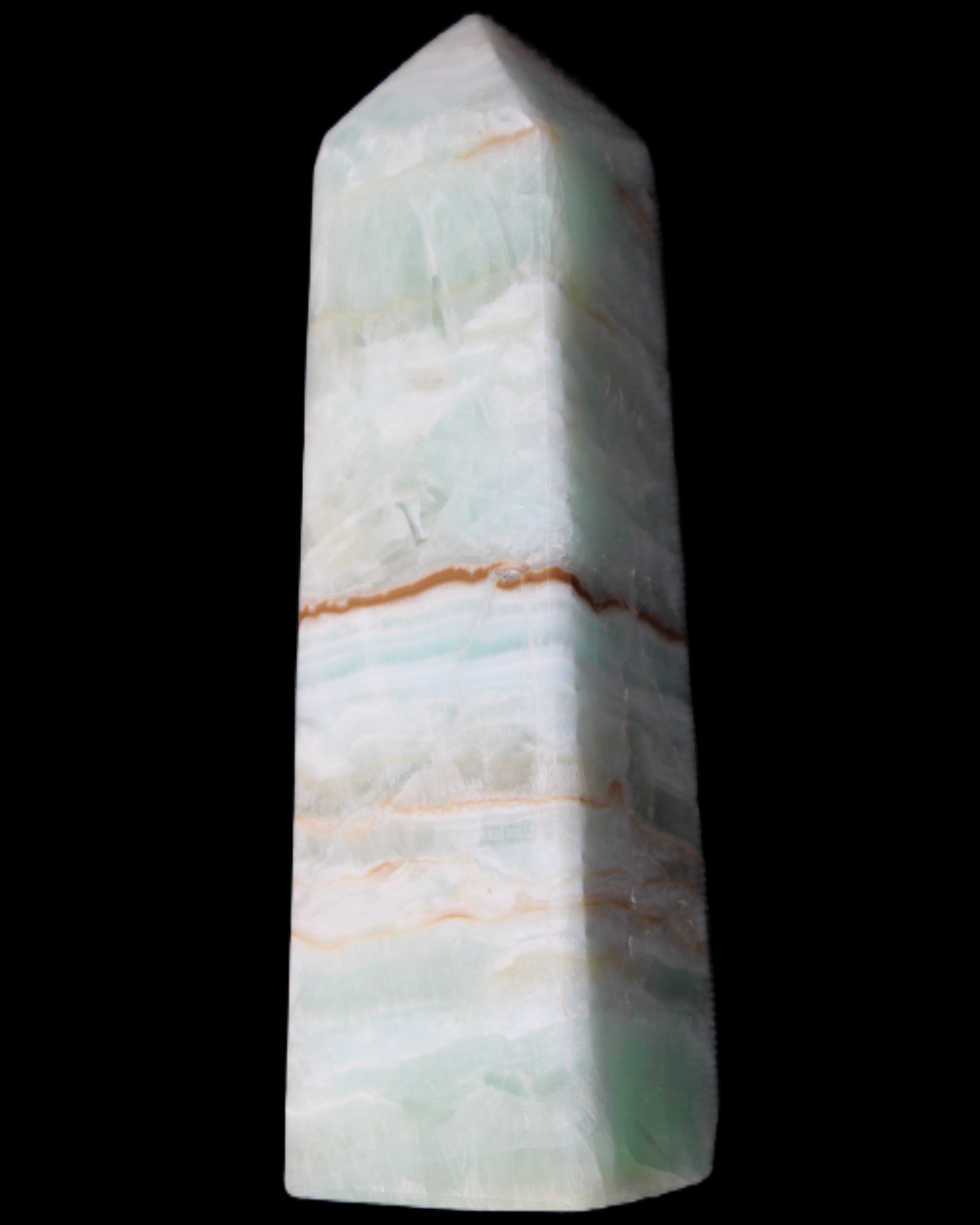 Pistachio Calcite obelisk 122mm 290g in sunlight - Rocks and Things Store