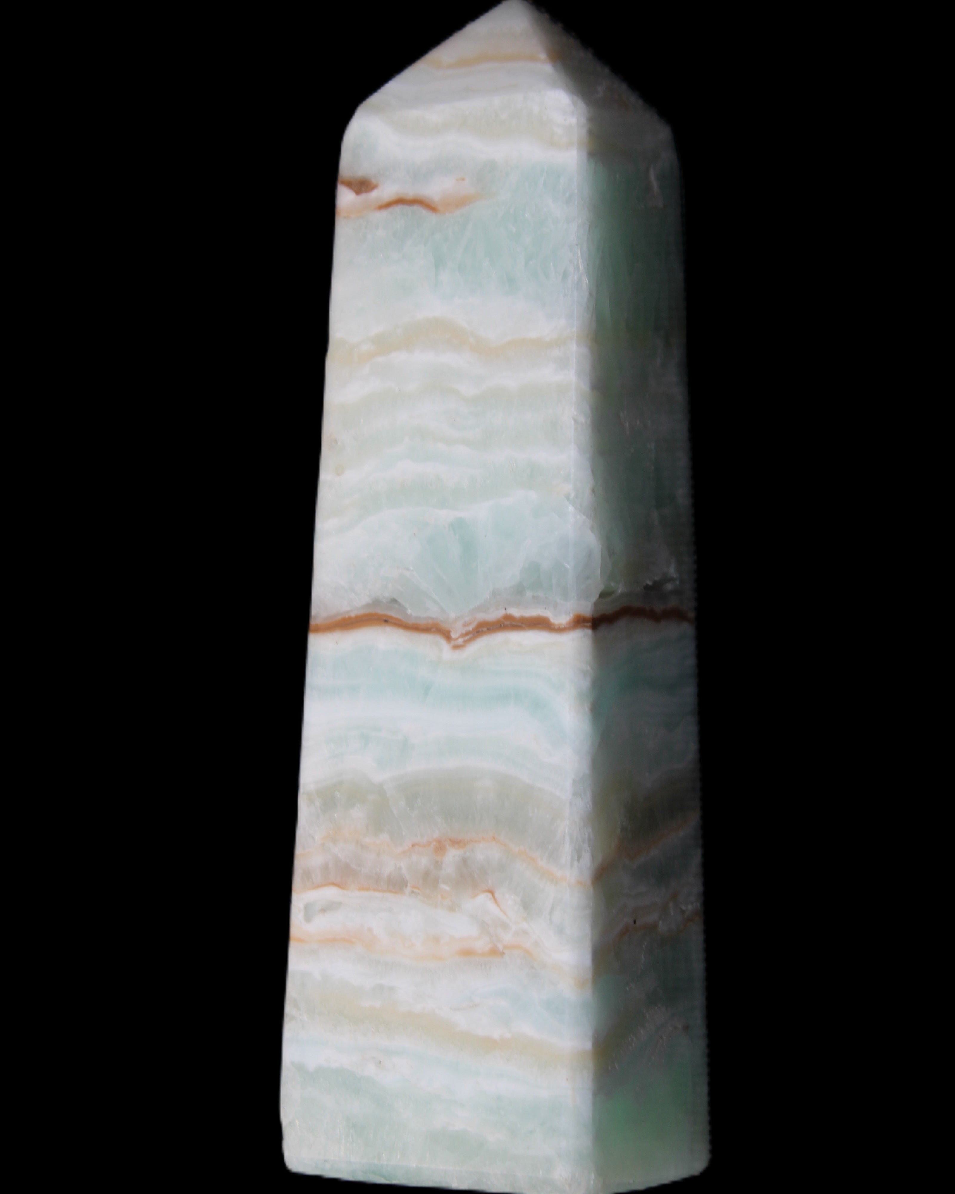 Pistachio Calcite obelisk 122mm 290g in sunlight - Rocks and Things Store