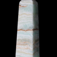 Pistachio Calcite obelisk 122mm 290g in sunlight - Rocks and Things Store