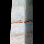 Pistachio Calcite obelisk 122mm 290g in sunlight - Rocks and Things Store